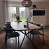 Eettafel Deens Ovaal Steel van massief hout met zwart stalen onderstel in moderne eetkamer met zes grijze stoelen