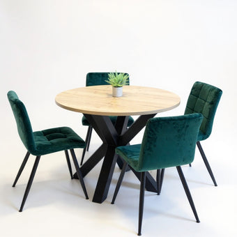 Industriële ronde eiken eettafel met zwart metalen spinpoot onderstel en groene velvet stoelen